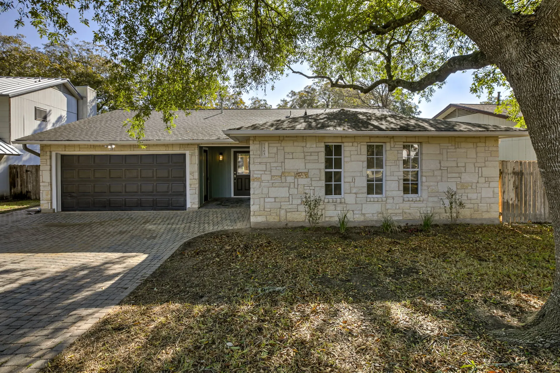 a house with a tree in front of it