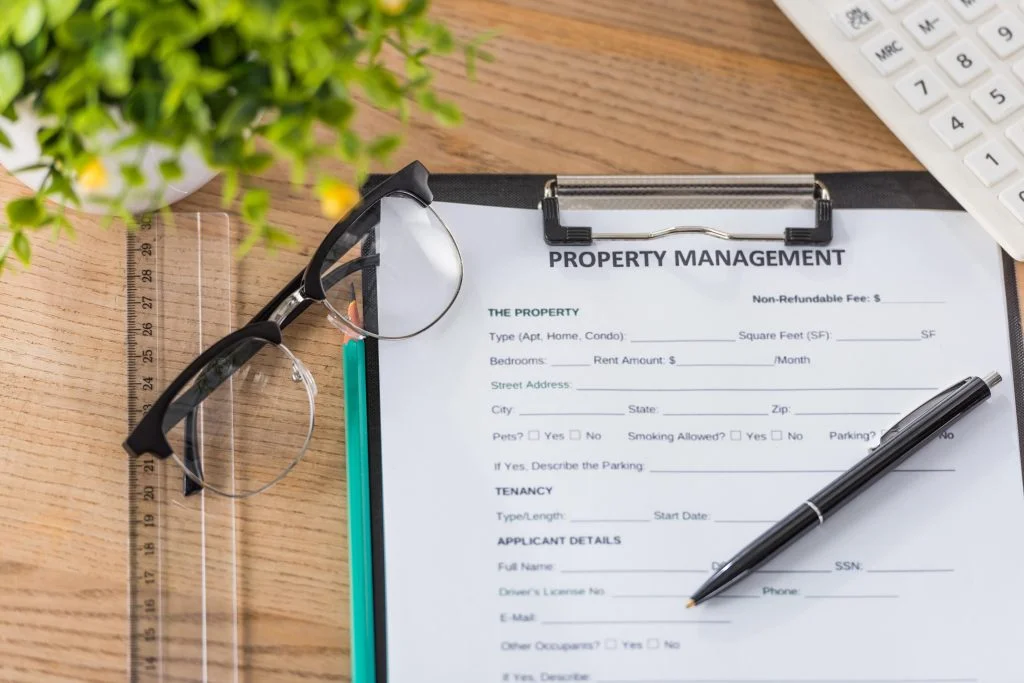 top-view-of-clipboard-with-property-management-agreement-attached